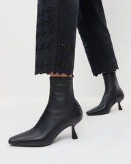 Thandy Black Leather Curved Heel Bootie