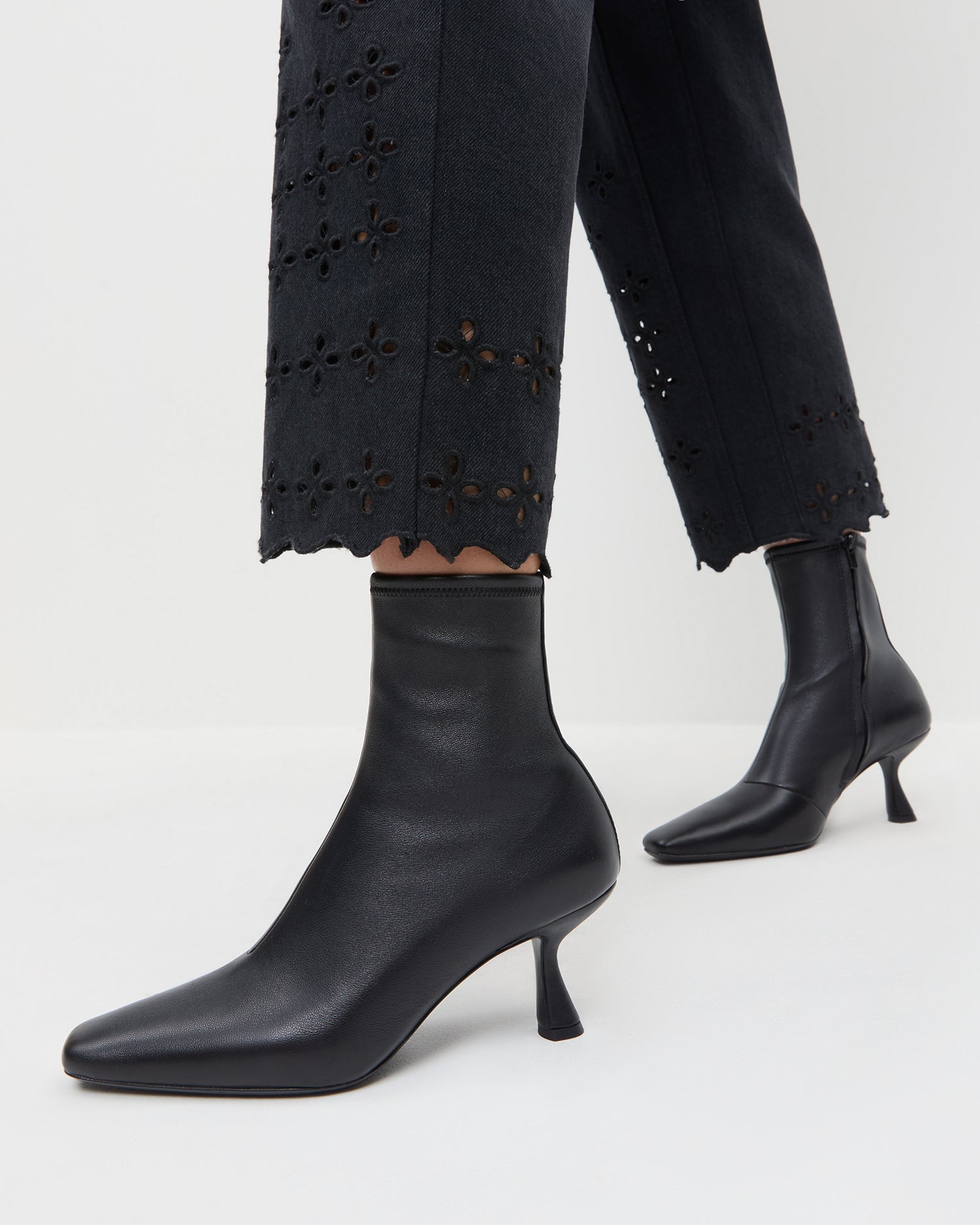 Thandy Black Leather Curved Heel Bootie