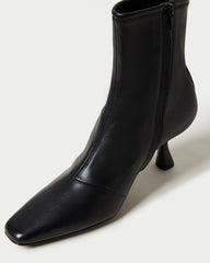 Thandy Black Leather Curved Heel Bootie