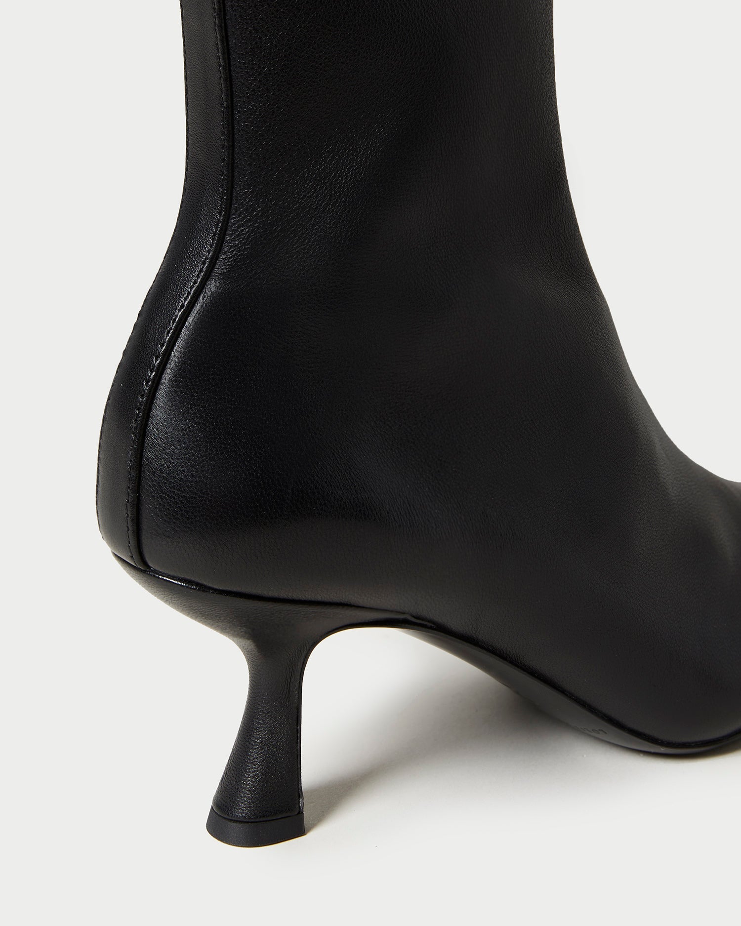 Thandy Black Leather Curved Heel Bootie