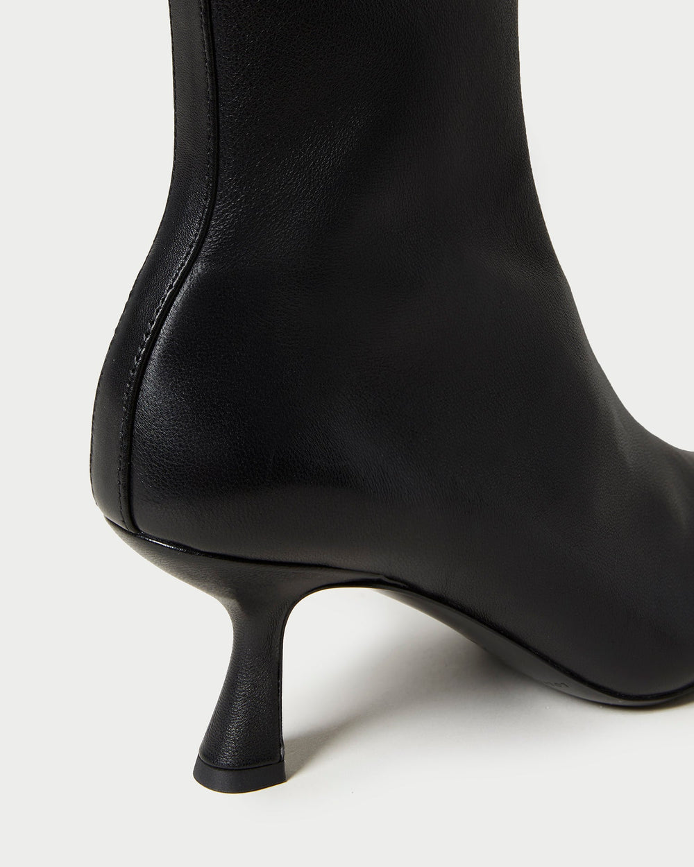 Thandy Black Leather Curved Heel Bootie